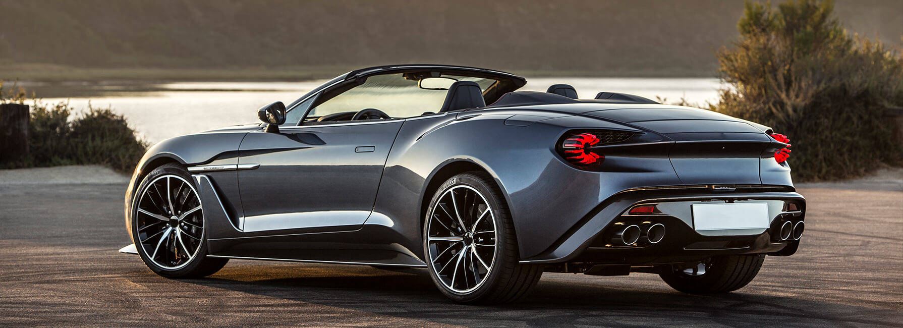 Back and side view of luxury sports car with roof off